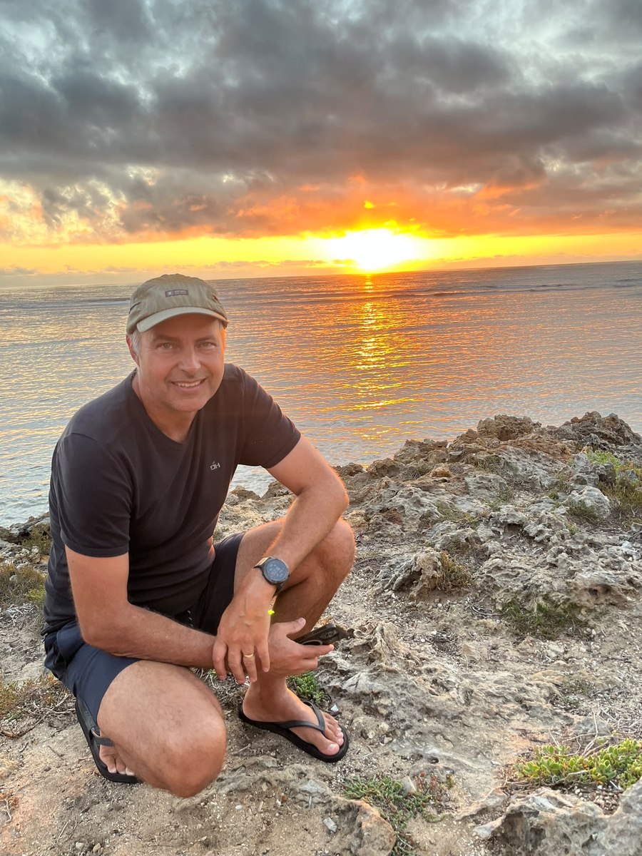 Johan, owner of Stipout Adventures, watching the sunset on the WA coast